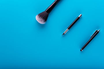 Office for business woman. Office composition. Top View. Flat lying. Blue background. Woman style, Woman blog. Girls Blog. Powder brush on table. Business Woman. Powder brush at office. Luxury office