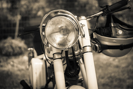 PAAREN IM GLIEN, GERMANY - MAY 23, 2015: Detail of motorcycle Simson Suhl AWO 425. Stylization. Vintage toning. The oldtimer show in MAFZ.