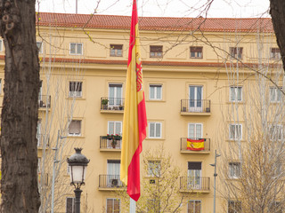 MADRID.SPAIN.18/03/20 .Flag of Spain Hanging in the Plaza de Marqués de Vadillo during the...