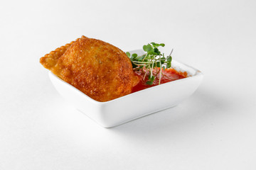 Crispy cracker with pate in spicy tomato sauce. Banquet festive dishes. Gourmet restaurant menu. White background.