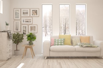 White living room with sofa and winter landscape in window. Scandinavian interior design. 3D illustration