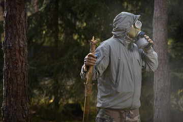 Fototapeta premium man in a gas mask protects himself from coronavirus