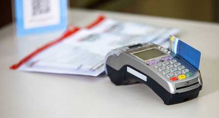 Credit card payment, buy and sell products & service, payment terminal in supermarket.