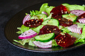 healthy salad beetroot slices, iceberg lettuce, greens. Menu concept food background, keto or paleo diet. top view. copy space for text
