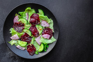 healthy salad beetroot slices, iceberg lettuce, greens. Menu concept food background, keto or paleo diet. top view. copy space for text