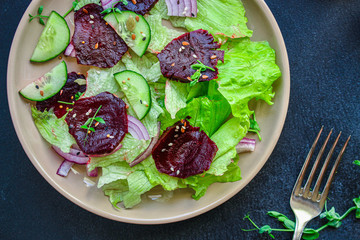 healthy salad beetroot slices, iceberg lettuce, greens. Menu concept food background, keto or paleo diet. top view. copy space for text