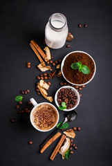 Composition on a yair background with milk, fragrant coffee, salted carmela, dried mushrooms, mint.