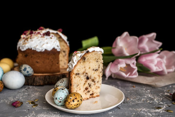 Easter cake on a tree log cabin, with beautiful painted eggs natural colors.