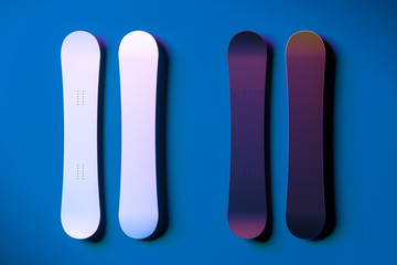White Blank Snowboard Near Dark Violet And Blue Blank Snowboard on Blue Background. 3d Rendering.