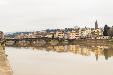 Beautiful Sights of Ponte Vecchio Bridge and Arno River in Florence, Italy.