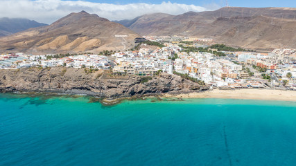 Morro Jable Canary Island, Fuerteventura Spain, Aerial view on coast of atlantic ocean and beach, Drone shot of sea 