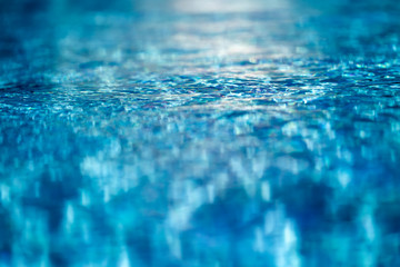 Clear blue drinking tap water. concept macro close up photo for sustainability. rippled full frame...