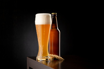 Bottle and glass of unfiltered wheat beer