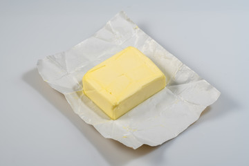 The wrapped butter is open for proper nutrition with amino acids for the normal functioning of the heart and itelect.