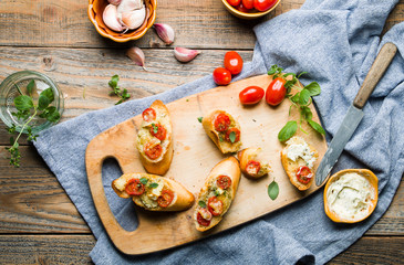 Baked toasts with garlic butter and tomatoes.