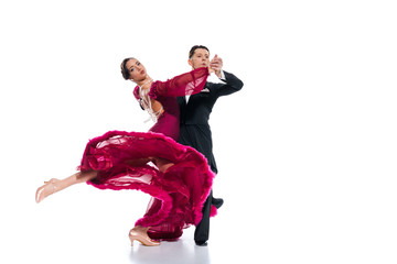 elegant young couple of ballroom dancers in red dress in suit dancing on white - obrazy, fototapety, plakaty