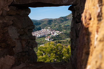 a stone window through which you can see nature