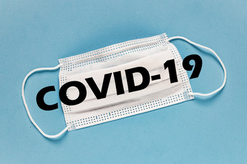 Coronavirus / Corona virus concept. Concept of fight against virus. Many Virus.Coronavirus - 2019-nCoV. Surgical mask protective mask with text. Chinese coronavirus outbreak. Blue background