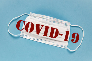 Coronavirus / Corona virus concept. Concept of fight against virus. Many Virus.Coronavirus - 2019-nCoV. Surgical mask protective mask with text. Chinese coronavirus outbreak. Blue background