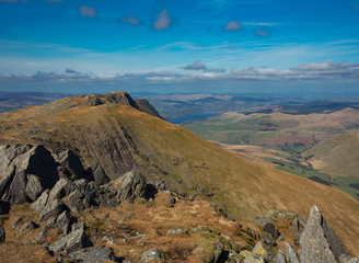 View from summit of a mountain looking towards a lake, Aran Fawddwy, Wales.