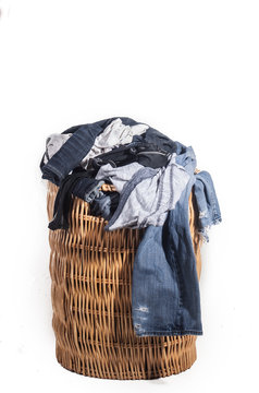 dirty laundry in whicker basket 