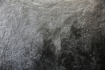 Black background. Abstract texture with dark concrete plaster.