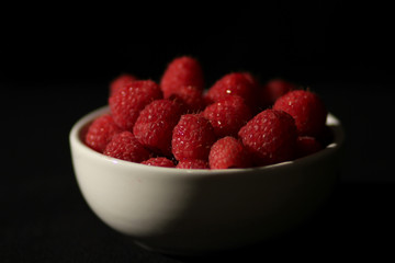 Bowl of Raspberries on Black