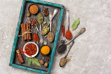Different spices, dry kitchen herbs and seeds for tasty meals