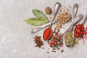 Different spices, dry kitchen herbs and seeds for tasty meals