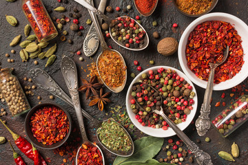 Different spices, dry kitchen herbs and seeds for tasty meals