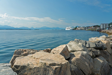 Norway, seafront of Norwegian town, cruise liner sea fjord view.
