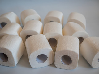 close up of a toilet paper roll on white background