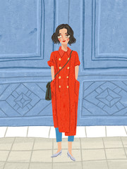 woman dressed in red in front of a blue gate