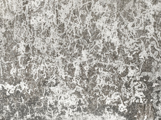 numerous traces on a light-coloured concrete wall