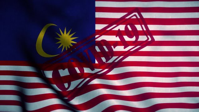 Covid-19 stamp on the national flag of Malaysia. Coronavirus concept