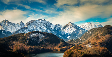Alps mountains in germany near the Hohenschwangau lake, castle and town. View from Neuschwanstein castle balcony.