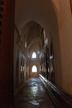 A corridor and niches with Buddha statues in the Ananda Temple, Old Bagan, Myanmar