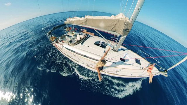 Half-round view of a lady relaxing on a floating boat