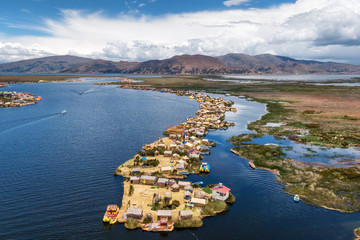 Aerial view of Uros Floating Islands on Lake Titicaca, the highest navigable lake in the world, on the border of Peru and Bolivia, South America.
