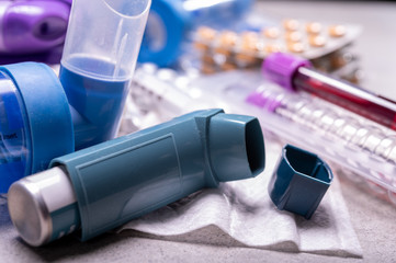 Different medicaments for asthma threatment, pills, inhalers, blood test-tubes and syringe,...