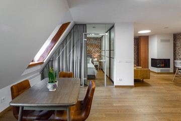 Modern contemporary interior of studio apartment. Private house. Brick wall.