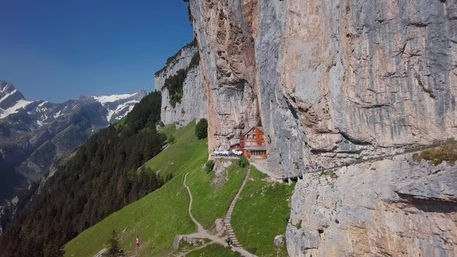Flight around of chalet in the rock on Ebenalp, Canton of Appenzell, Switzerland