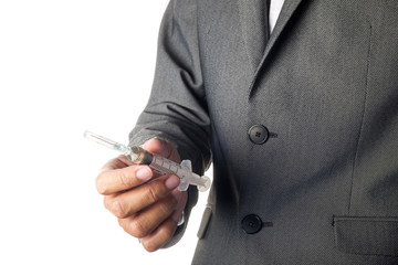 Man in suit holding syringe