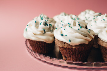 Tasty cupcakes on a pink background. Birthday cupcakes. Candy bar. Wedding. Party.