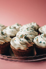 Tasty cupcakes on a pink background. Birthday cupcakes. Candy bar. Wedding. Party.