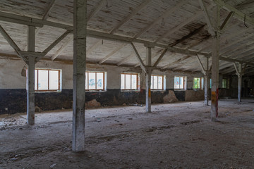 old brick abandoned farmhouse with wooden roof collapses from old age