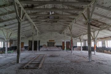 old brick abandoned farmhouse with wooden roof collapses from old age