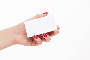 elegant female hand with red pink nails and business card