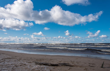 Storm and deserted beach on the Baltic Sea on a cold March day.