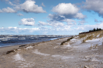 Deserted beach and storm on the Baltic Sea on a cold March day.